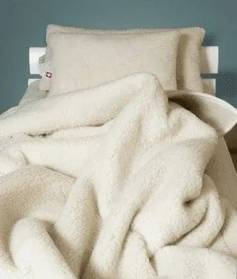 Volta à natureza: Os benefícios da lã Merino vs Cashmere 4 ovelhas-tipos-de-lã-swissmade-direct