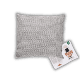A grey pillow on a black background.
