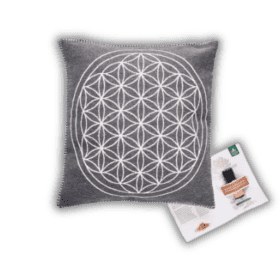 A cushion with a flower of life design on it.