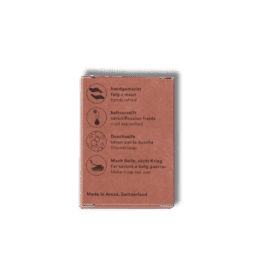 Pastilla de jabón artesanal en frío de Seifenmacher, fabricada en Suiza, en Arosa, con símbolos icónicos en su envase.