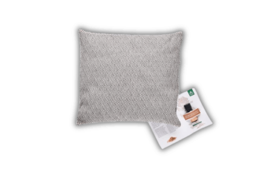 A grey pillow on a black background.