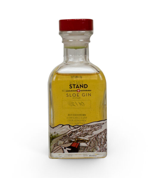 A bottle of stand gin on a white background.