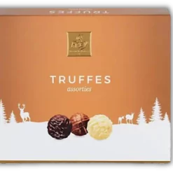 A box of Frey Assorted Truffles Pralines on a black background.